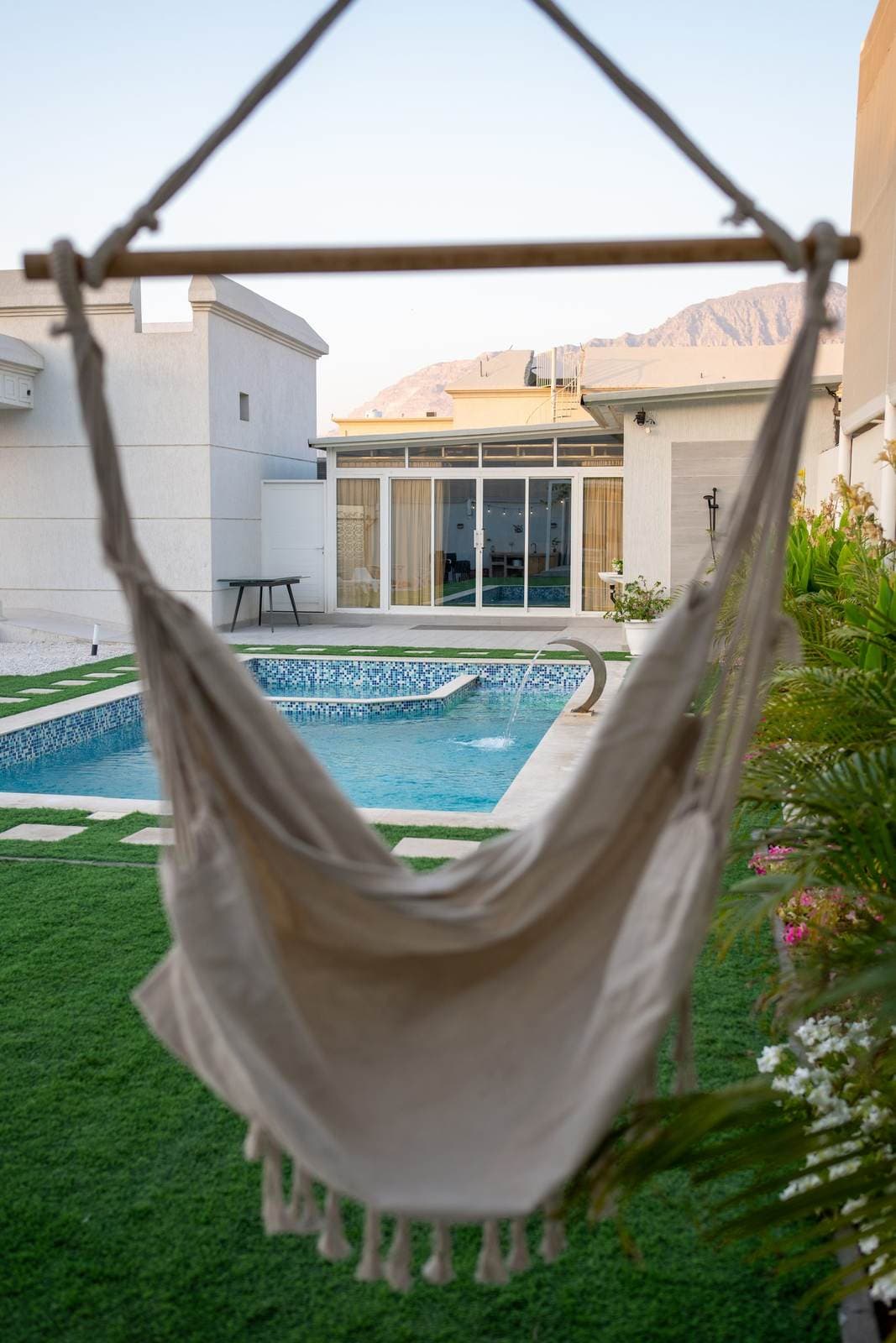 Hanging chair by the pool